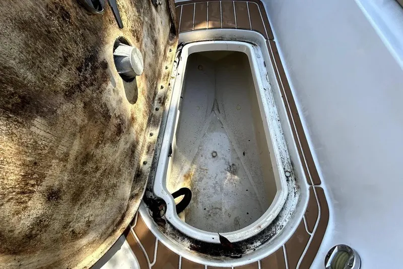 Slide: The Image of Open storage compartment on a 2007 Sea Ray 260 Sundeck boat, showing interior condition. - 51