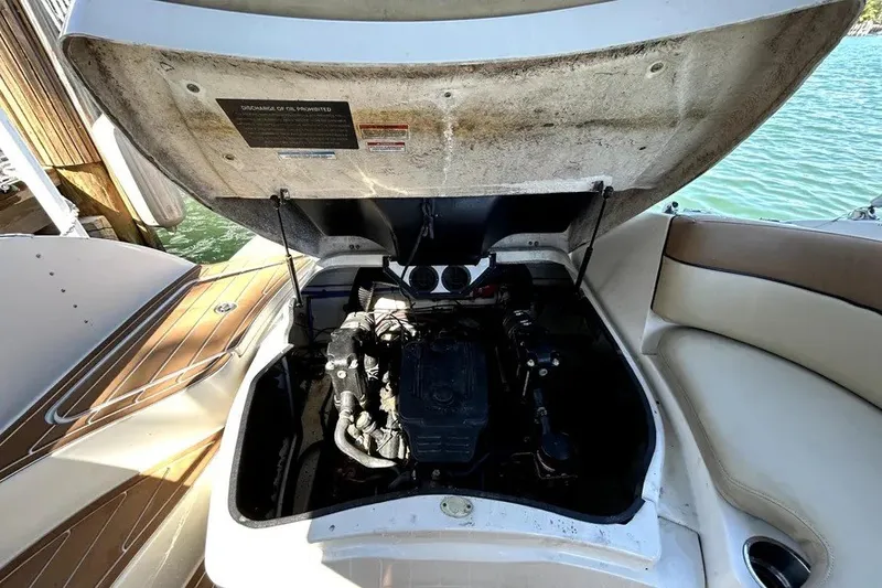 Slide: The Image of 2007 Sea Ray 260 Sundeck engine compartment with open hatch, dockside view. - 40