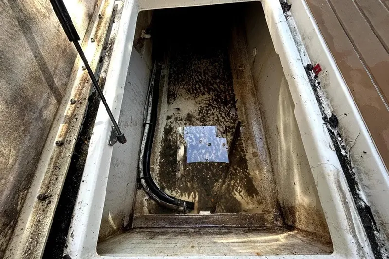 Slide: The Image of 2007 Sea Ray 260 Sundeck storage compartment, showing interior condition and components. - 48
