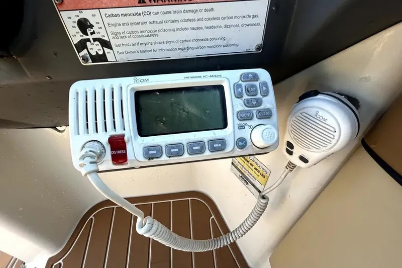 Slide: The Image of VHF marine radio on 2007 Sea Ray 260 Sundeck, with distress button and microphone. - 81