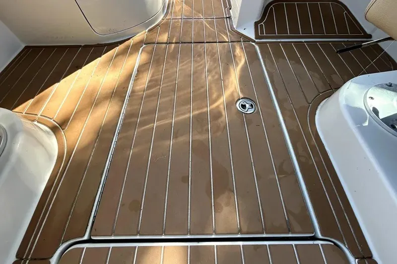 Slide: The Image of Teak deck of 2007 Sea Ray 260 Sundeck boat, showcasing elegant design. - 46