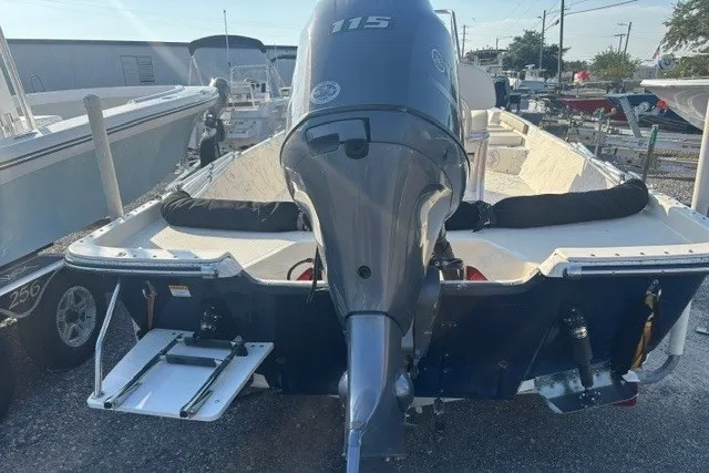 Slide: The Image of 2016 K2 Marine 2104 Frontier boat with 115 horsepower engine, docked outdoors. - 4