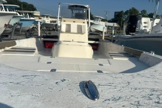 Slide: The Image of 2016 K2 Marine 2104 Frontier boat in a marina, showcasing interior and console. - 7