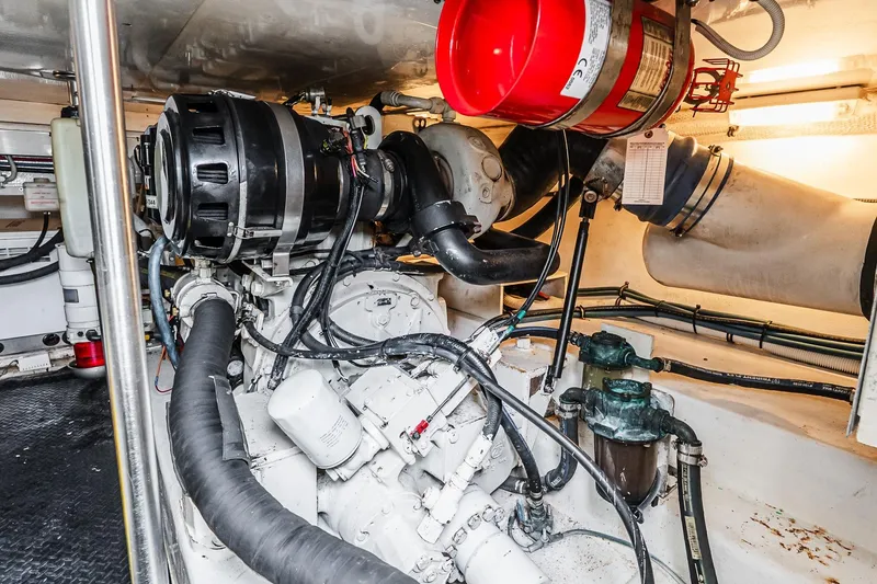 Slide: The Image of Engine room of 2003 Egg Harbor 42 Convertible yacht, showcasing mechanical components and systems. - 39
