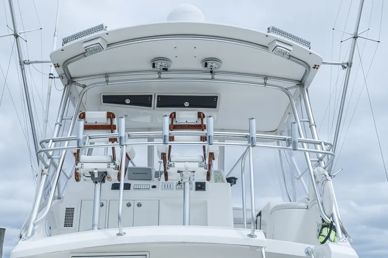 Slide: The Image of 2003 Egg Harbor 42 Convertible yacht helm with chairs and navigation equipment. - 24