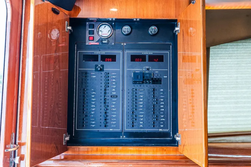 Slide: The Image of Electrical control panel inside a 2003 Egg Harbor 42 Convertible yacht. - 18