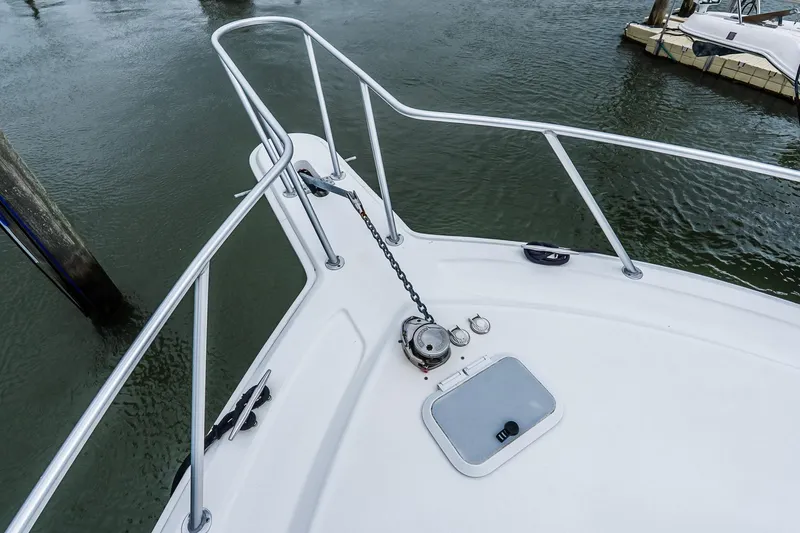 Slide: The Image of Bow of 2003 Egg Harbor 42 Convertible yacht with anchor chain and railing. - 37