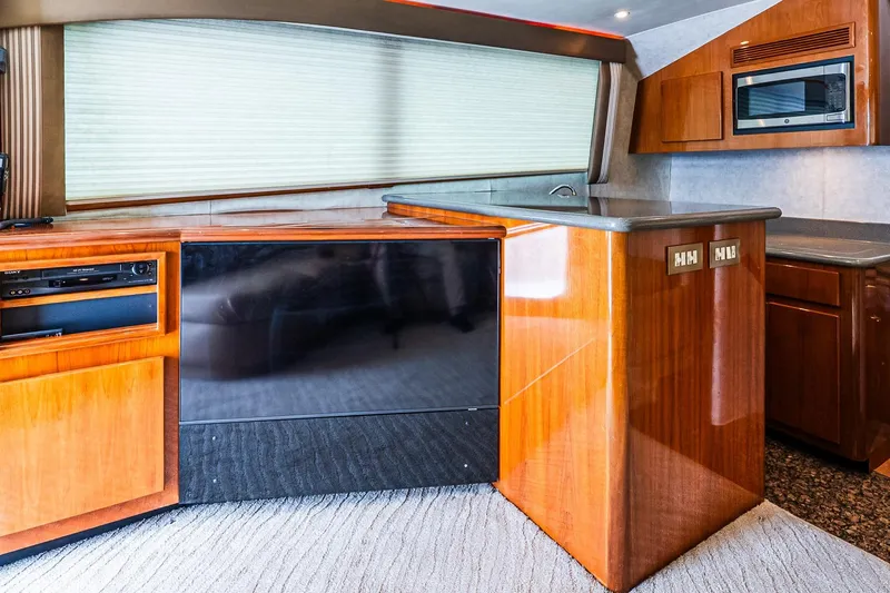 Slide: The Image of Interior of 2003 Egg Harbor 42 Convertible yacht with wood cabinetry and modern appliances. - 15