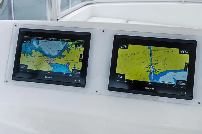 Slide: The Image of Dual Garmin navigation screens on 2003 Egg Harbor 42 Convertible yacht dashboard. - 35