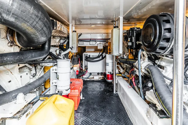 Slide: The Image of Engine room of 2003 Egg Harbor 42 Convertible yacht, showcasing mechanical components and equipment. - 38