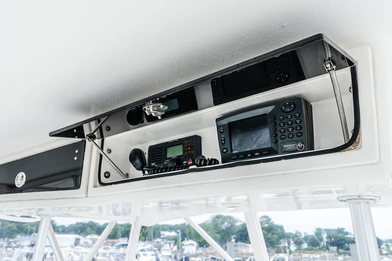 Slide: The Image of 2003 Egg Harbor 42 Convertible boat electronics panel with navigation and communication devices. - 34
