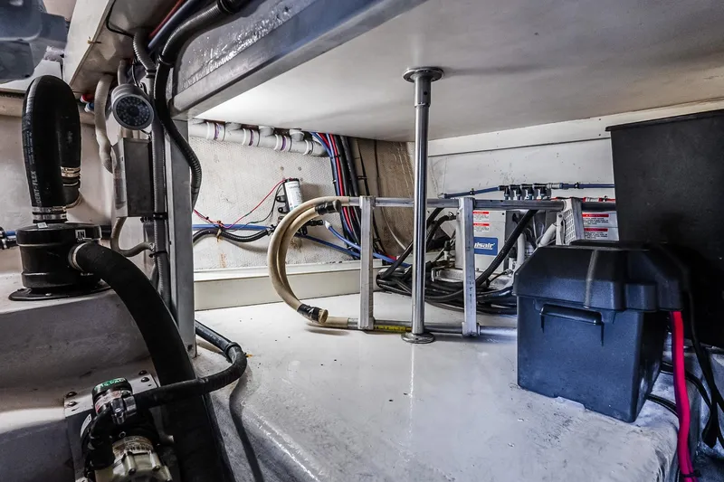 Slide: The Image of Engine room of 2003 Egg Harbor 42 Convertible boat, showcasing wiring and components. - 41