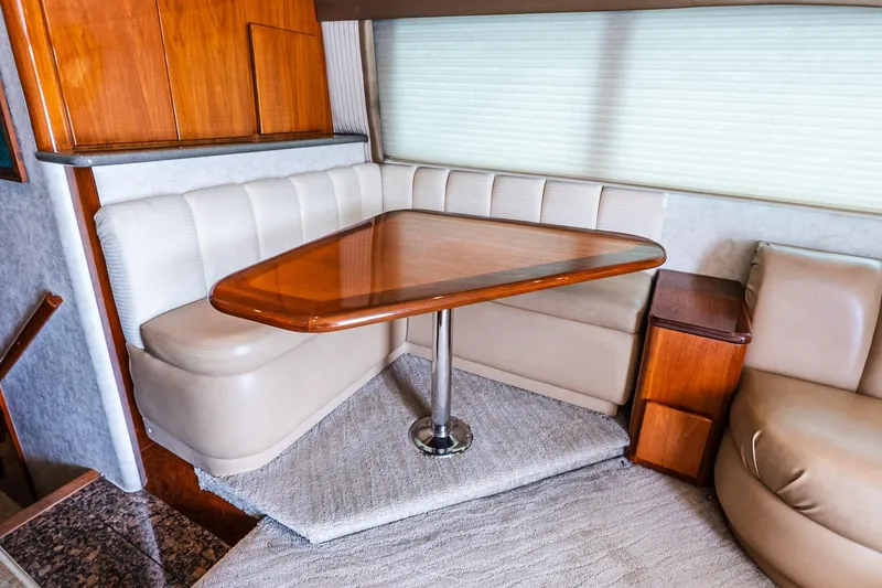 Slide: The Image of Luxurious interior of 2003 Egg Harbor 42 Convertible yacht with elegant dining area. - 16
