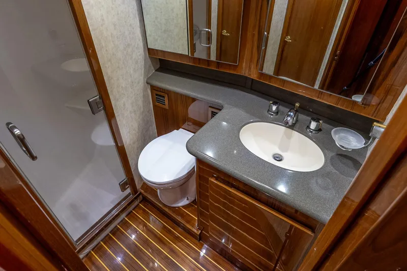 Slide: The Image of Luxurious bathroom in 2003 Egg Harbor 42 Convertible yacht with modern fixtures and wood accents. - 21