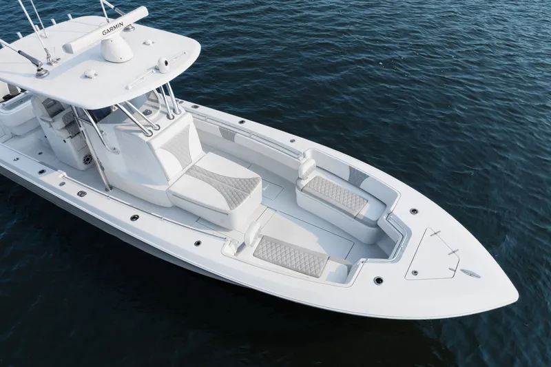 Slide: The Image of 2025 Contender 32 ST boat on water, featuring sleek design and spacious seating. - 7