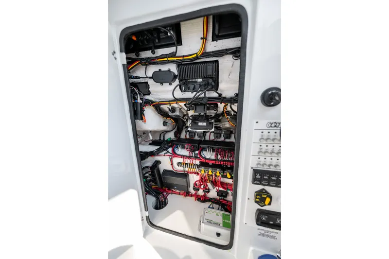 Slide: The Image of Electrical system inside 2025 Contender 32 ST boat, showcasing wiring and components. - 38