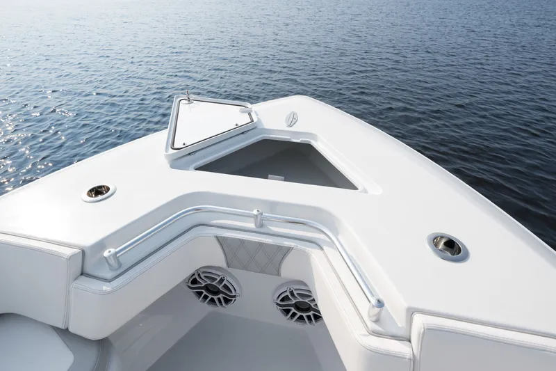 Slide: The Image of 2025 Contender 32 ST boat bow with open hatch on calm water. - 9