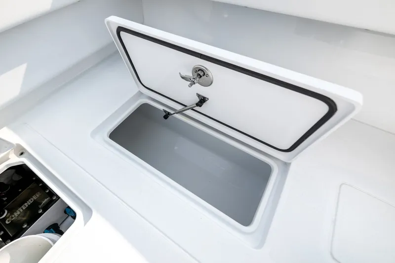 Slide: The Image of Open storage compartment on 2025 Contender 32 ST boat, showcasing sleek design and functionality. - 33