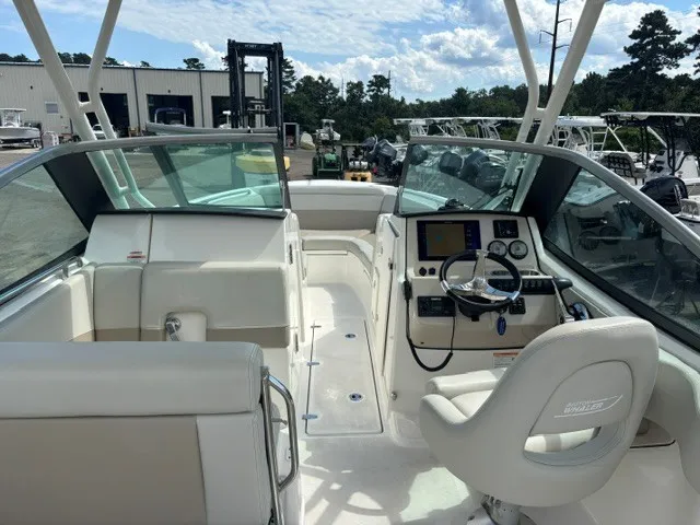 Slide: The Image of The image shows the cockpit of a 2025 Boston Whaler 240 Vantage. It features white seating and a modern dashboard. - 11