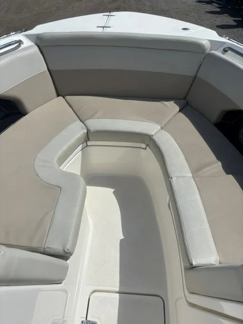 Slide: The Image of The bow of a 2025 Boston Whaler 240 Vantage with beige and white upholstery. - 5