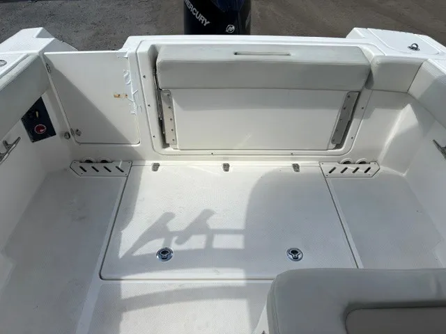 Slide: The Image of The image shows the spacious aft deck of a Boston Whaler 240 Vantage boat with white upholstery. - 10