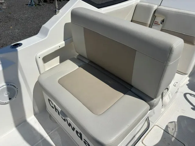 Slide: The Image of The 2025 Boston Whaler 210 Vantage features a cushioned bench seat with a light, modern design. - 11