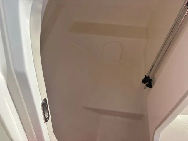Slide: The Image of Interior of a 2025 Boston Whaler 210 Vantage with smooth, white surfaces. - 7