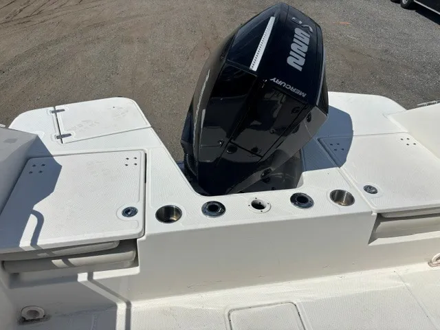 Slide: The Image of The image shows the stern of a Boston Whaler 210 Vantage boat with a Mercury outboard motor. - 5