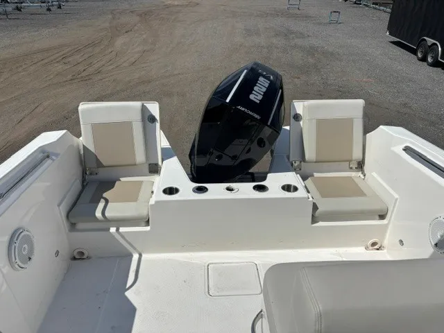 Slide: The Image of The image shows the stern area of a Boston Whaler 210 Vantage with two seats and an outboard motor. - 6