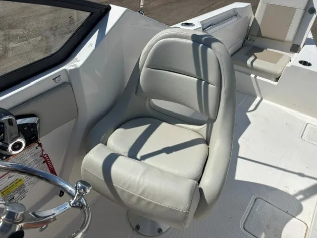 Slide: The Image of A modern helm with a cushioned captain's chair and stainless steel steering wheel. - 10