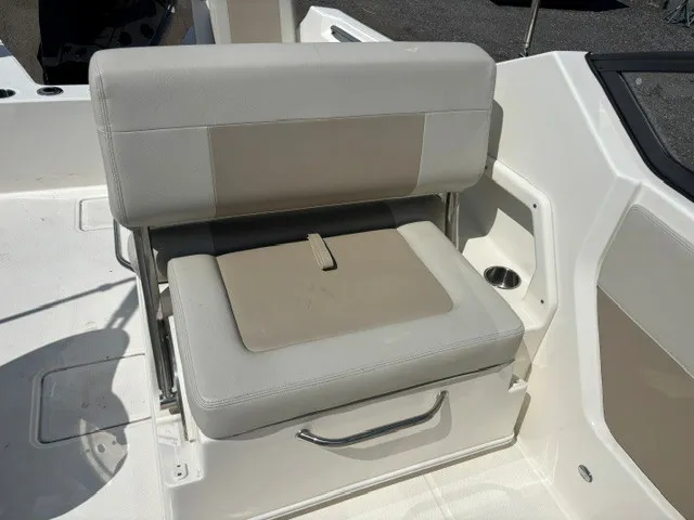 Slide: The Image of A cushioned seat on a boat with storage underneath, surrounded by a white surface. - 9