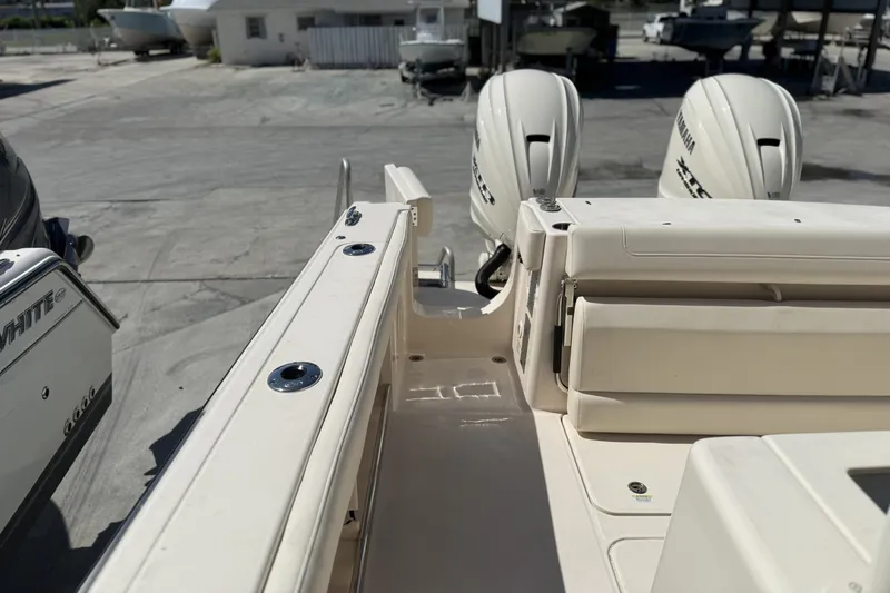 Slide: The Image of 2026 Grady-White Canyon 336 boat with twin Yamaha engines at a marina. - 33