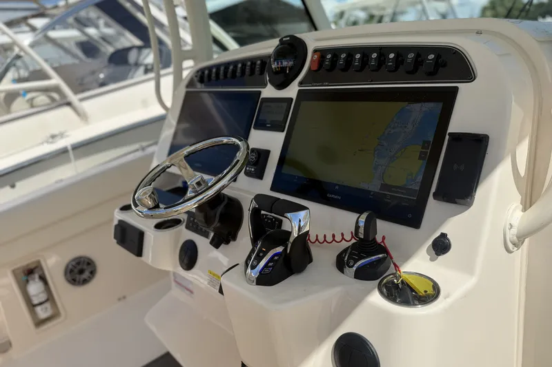 Slide: The Image of Control panel of 2026 Grady-White Canyon 336 boat with navigation display. - 15