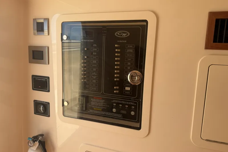 Slide: The Image of Electrical panel on 2026 Grady-White Canyon 336 boat, featuring control switches and indicators. - 26