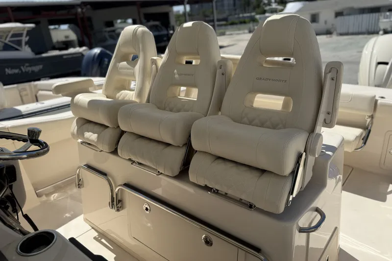 Slide: The Image of 2026 Grady-White Canyon 336 boat seats, featuring luxurious beige upholstery and ergonomic design. - 16