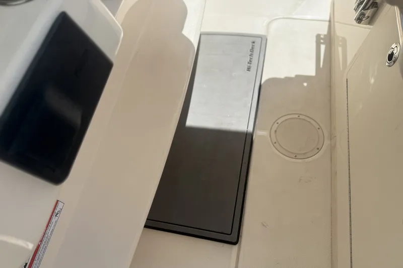 Slide: The Image of Interior view of 2026 Grady-White Canyon 336 boat deck, featuring a non-slip mat. - 18