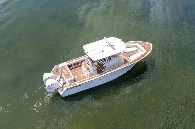 Slide: The Image of 2015 Grady-White Canyon 306 boat on calm water, aerial view. - 15