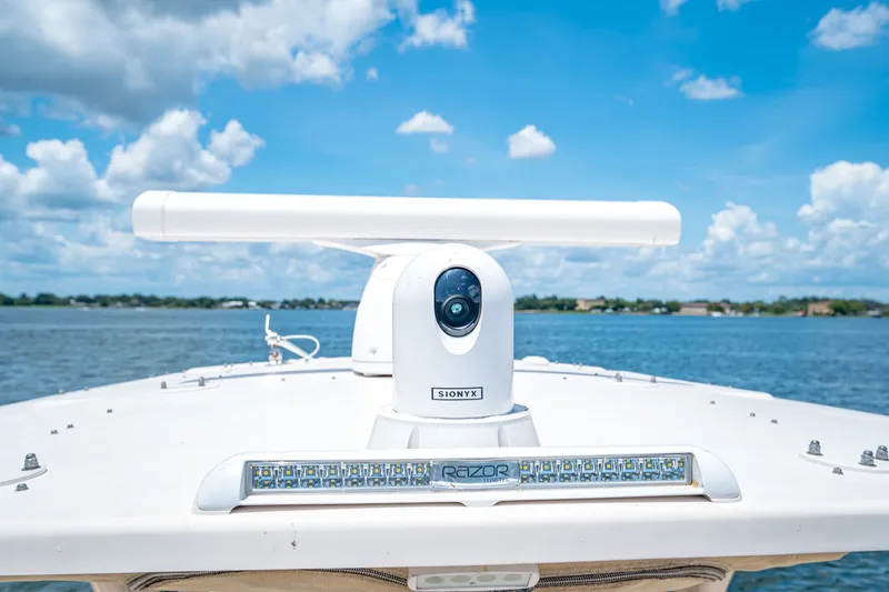 Slide: The Image of 2015 Grady-White Canyon 306 boat with advanced navigation equipment on a sunny day. - 42
