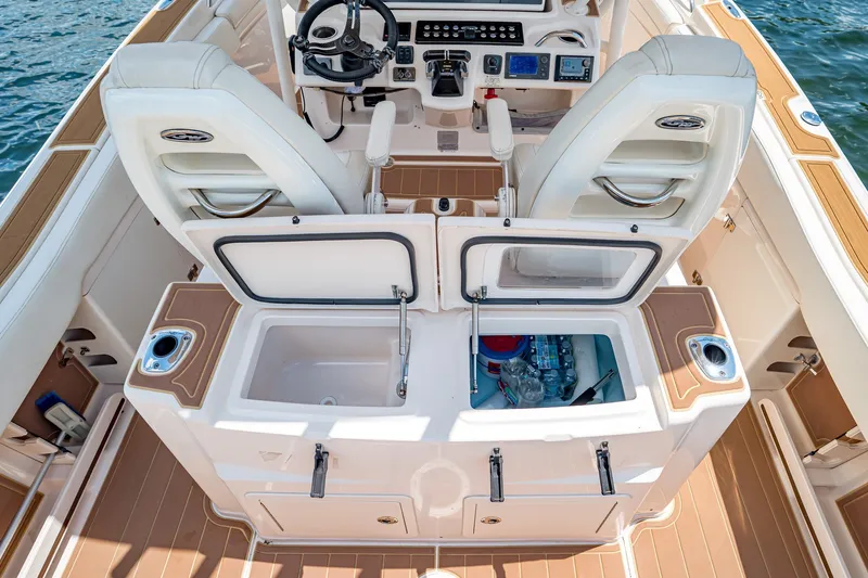 Slide: The Image of 2015 Grady-White Canyon 306 boat interior with helm and storage compartments. - 26
