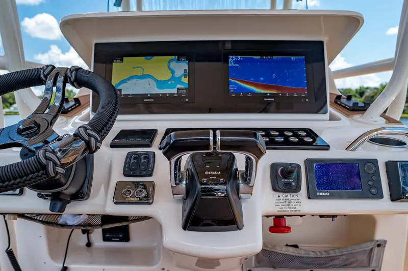 Slide: The Image of Helm of 2015 Grady-White Canyon 306 with advanced navigation and control systems. - 35