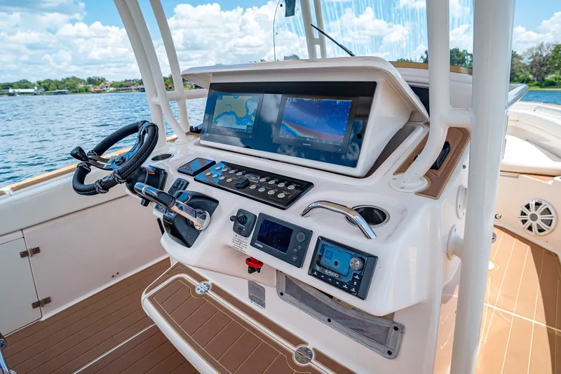 Slide: The Image of 2015 Grady-White Canyon 306 boat dashboard with advanced navigation systems. - 36