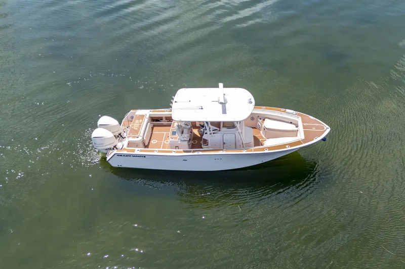 Slide: The Image of 2015 Grady-White Canyon 306 boat on calm water, aerial view. - 16
