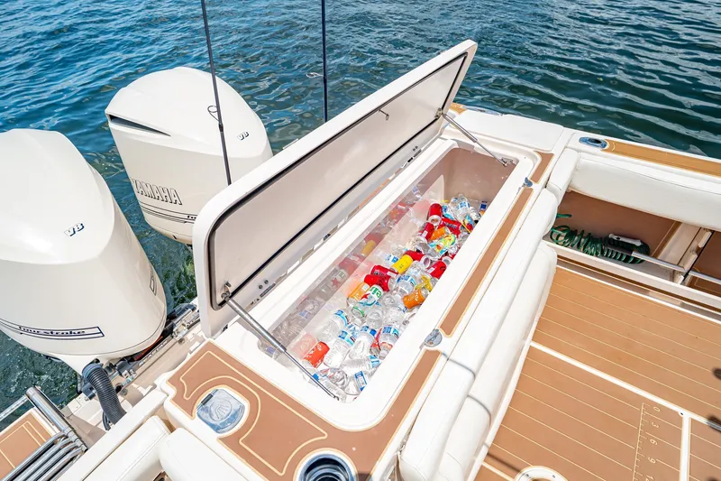 Slide: The Image of Grady-White Canyon 306 boat with open cooler, filled with drinks, on a sunny day. - 28