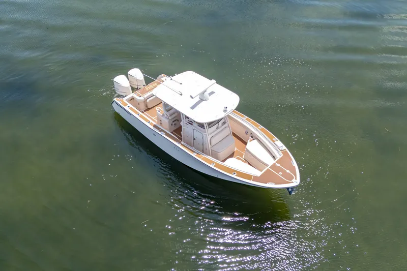 Slide: The Image of 2015 Grady-White Canyon 306 boat on calm water, aerial view. - 17