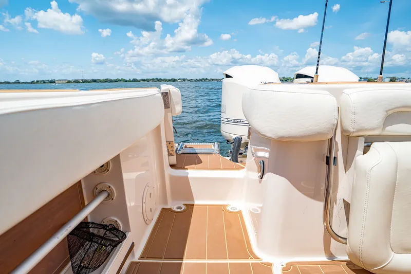 Slide: The Image of 2015 Grady-White Canyon 306 boat interior with ocean view and clear sky. - 29