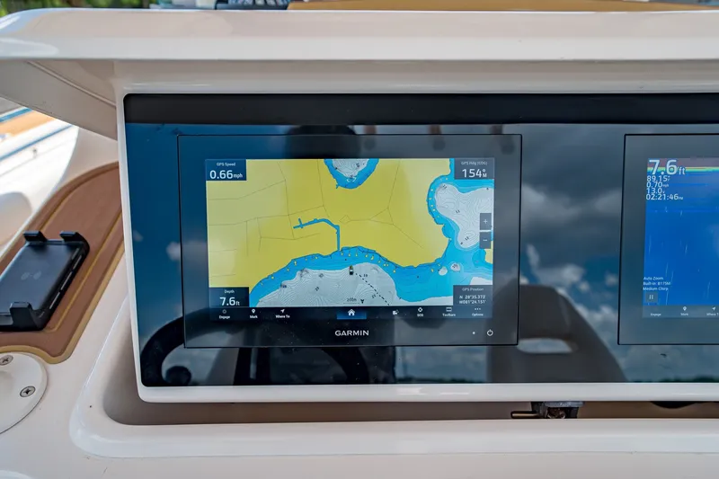 Slide: The Image of Garmin navigation display on 2015 Grady-White Canyon 306 boat dashboard. - 32
