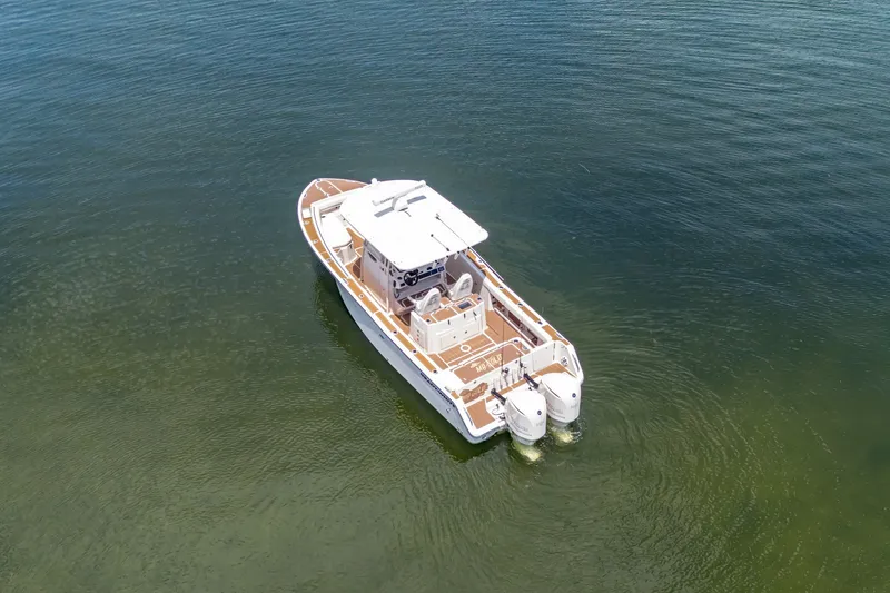 Slide: The Image of 2015 Grady-White Canyon 306 boat on calm water, aerial view. - 14