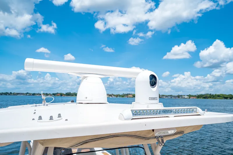 Slide: The Image of 2015 Grady-White Canyon 306 boat with radar and camera on a sunny day. - 43
