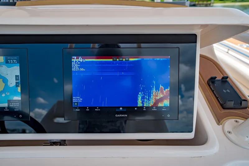 Slide: The Image of Garmin marine display on 2015 Grady-White Canyon 306 boat dashboard. - 33