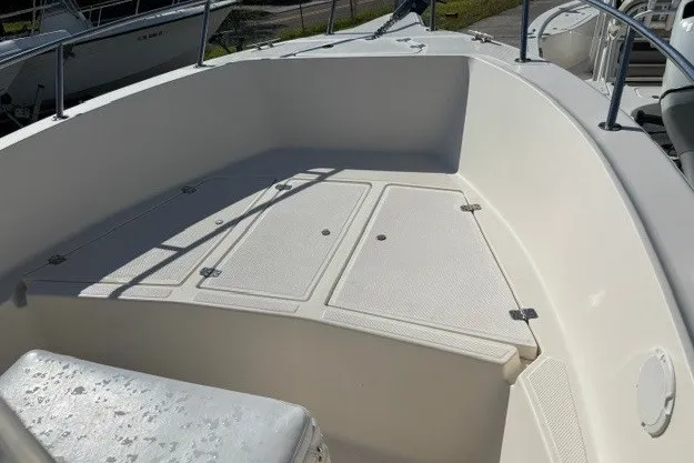 Slide: The Image of 2005 Key West 225 Center Console boat deck with storage compartments. - 10